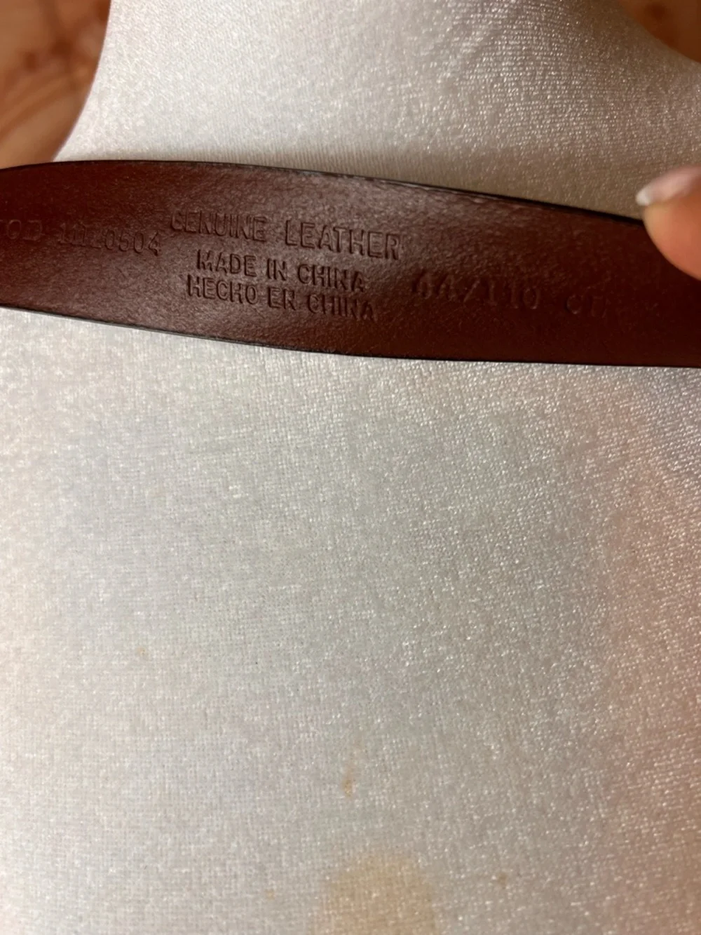 Izod Unique vintage genuine leather belt features a classic brown leather strap
